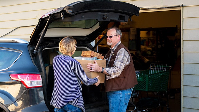 Photo of lady donating items at the store
